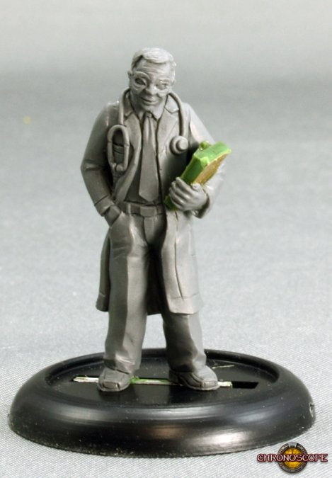 Statue of a doctor holding a book on a gray background. Reaper Miniatures Dr. Thomas Welby M.D. metal unpainted