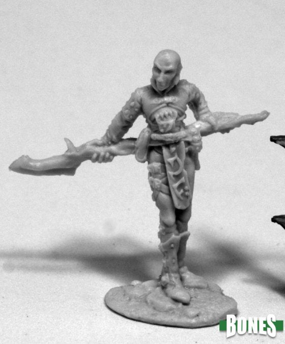 Unpainted miniature figure of a wizard with a staff on a white background, featuring the 'Bones' brand. Reaper Miniatures mercenary wizard
