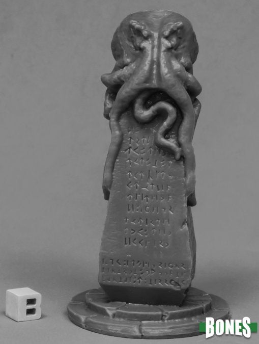 Dark gray sculpture of a creature with text on a gray background, featuring the brand 'Bones'. Reaper Miniatures Great Obelisk of C'thulhu