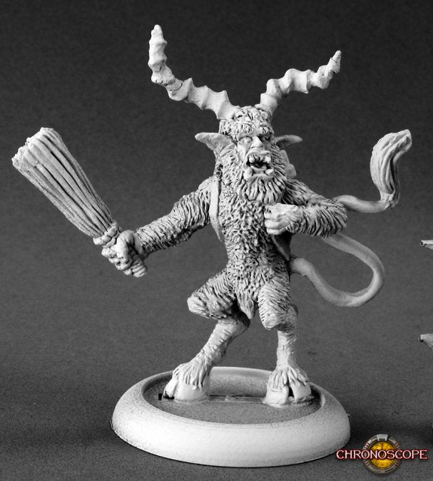 Fantasy figurine with antlers and a weapon on a gray background. Reaper Miniatures Krampus