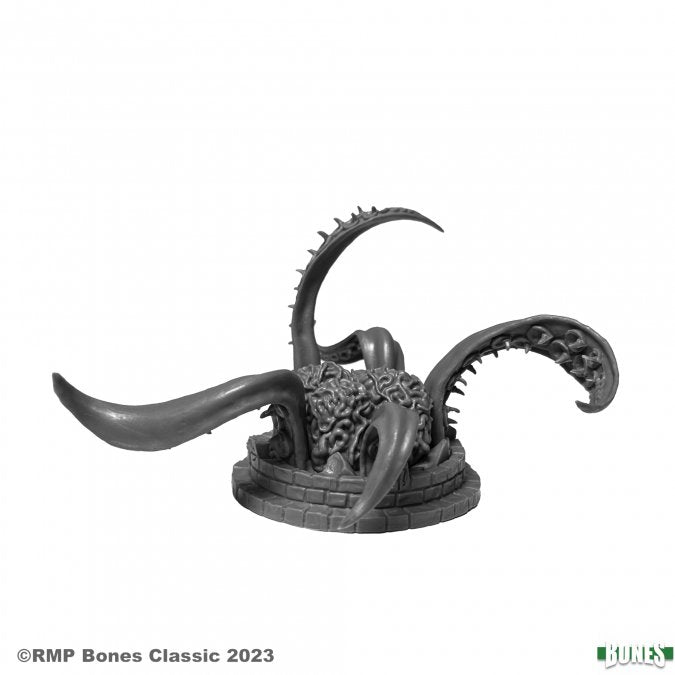 Gray fantasy creature figurine on a white background