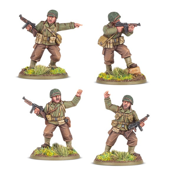 Four  Bolt Action military figures in various poses on a white background. Resin figures painted