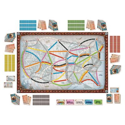 Ticket to ride game board with cards and accessories laid out